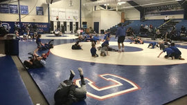 What is the key to a successful wrestling program?